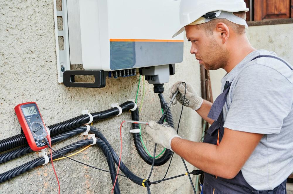 Technician reading pressures during a heat pump diagnosis